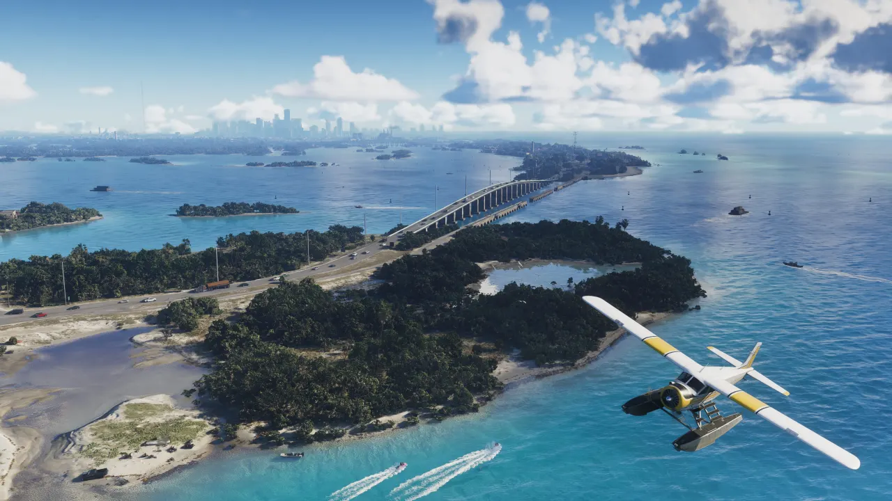 Aerial view of a bridge crossing turquoise water in the Leonida Keys with a seaplane in the foreground